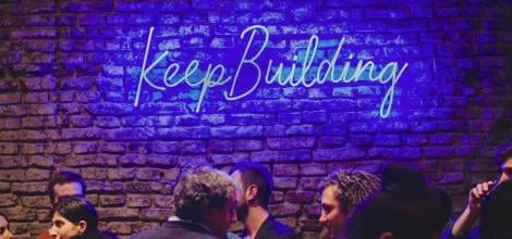 Neon light displaying Keep Building