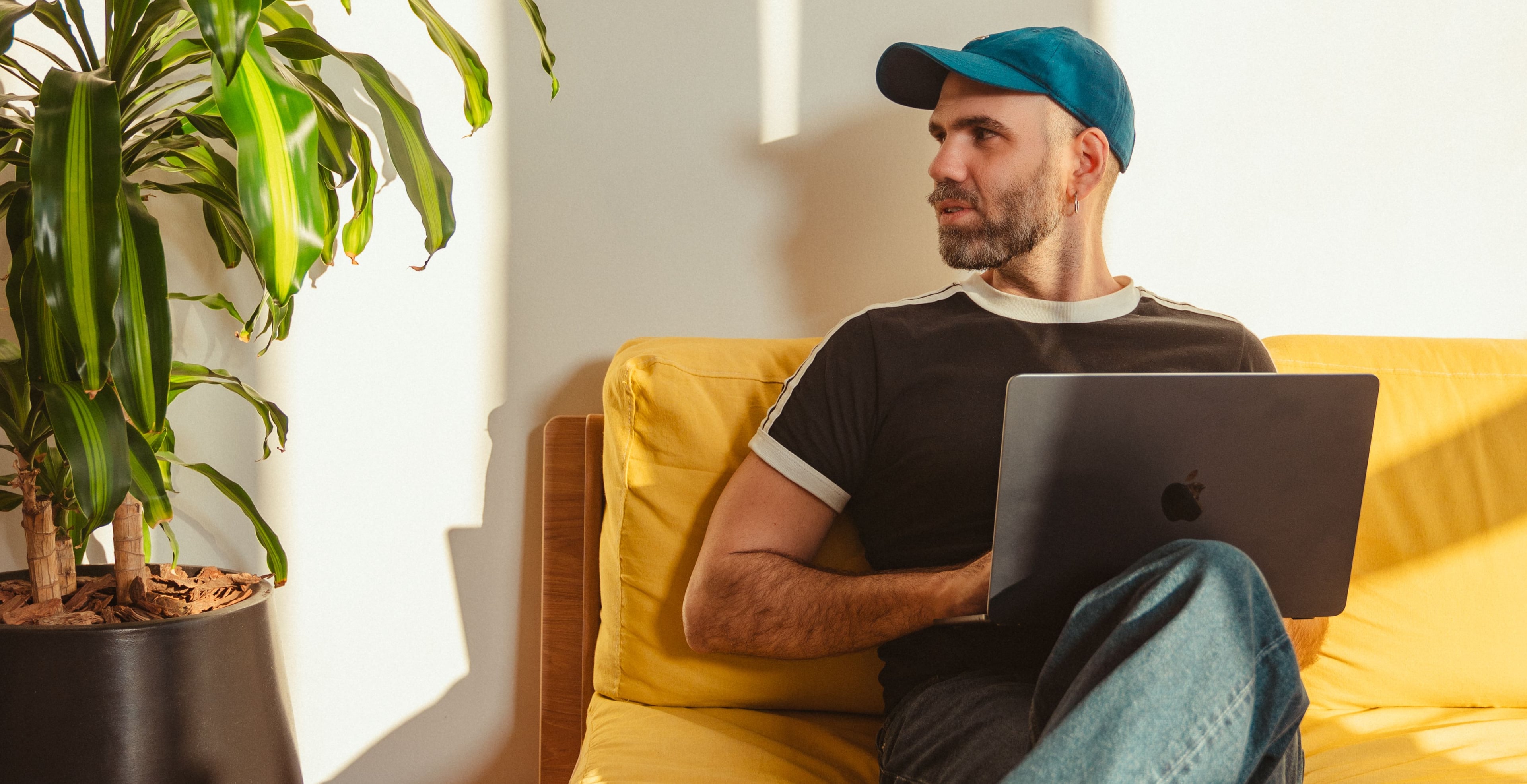 Person sitting with a laptop 
